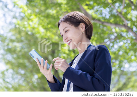 Portrait of a woman with a business smartphone Portrait of a woman with a business smartphone 125336282