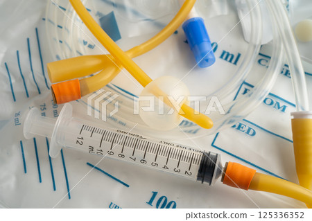 Foley urinary catheter with urine bag for disability or patient in hospital. 125336352