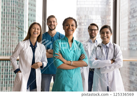 Modern day doctors posing for portrait in contemporary clinic office 125336569