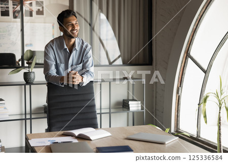 Dreaming of happy corporate future. Smiling confident Dreaming of happy corporate future. Smiling confident 125336584