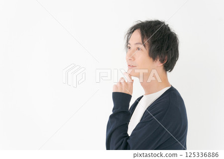 A man in his 30s in a worried pose A man in his 30s in a worried pose 125336886