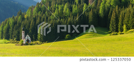 Idyllic countryside chapel in lush green valley landscape near Valley of Funes at Dolomites, Italy Idyllic countryside chapel in lush green valley landscape near Valley of Funes at Dolomites, Italy 125337050