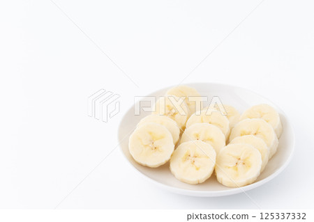 Banana slices on a plate Banana slices on a plate 125337332