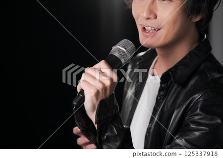 Musician singing a song Musician singing a song 125337918