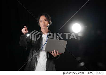 Man giving instructions on stage 125338470