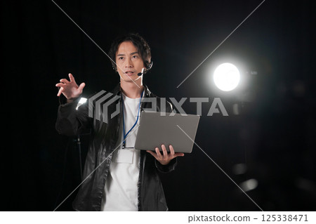 Man giving instructions on stage 125338471