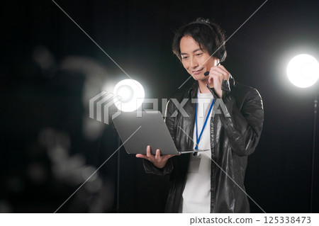 Man giving instructions on stage 125338473