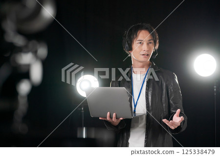Man giving instructions on stage 125338479