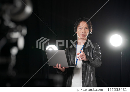Man giving instructions on stage Man giving instructions on stage 125338481