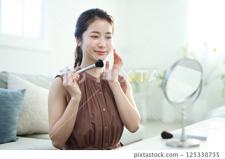 A young lady in makeup A young lady in makeup 125338735