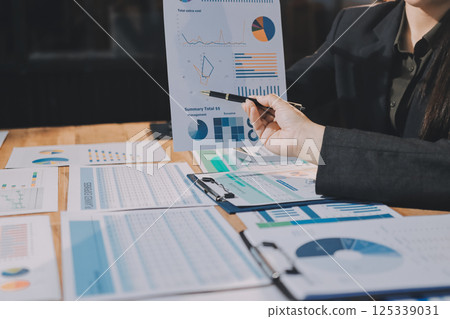 Business analyze,Close up Business people meeting to discuss the situation on the market. Business Financial Concept 125339031