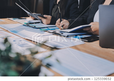 Business analyze,Close up Business people meeting to discuss the situation on the market. Business Financial Concept 125339032