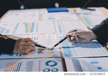 Business analyze,Close up Business people meeting to discuss the situation on the market. Business Financial Concept 125339037