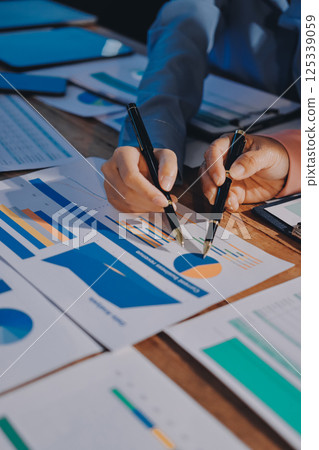 Business analyze,Close up Business people meeting to discuss the situation on the market. Business Financial Concept Business analyze,Close up Business people meeting to discuss the situation on the market. Business Financial Concept 125339059