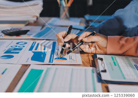 Business analyze,Close up Business people meeting to discuss the situation on the market. Business Financial Concept Business analyze,Close up Business people meeting to discuss the situation on the market. Business Financial Concept 125339060