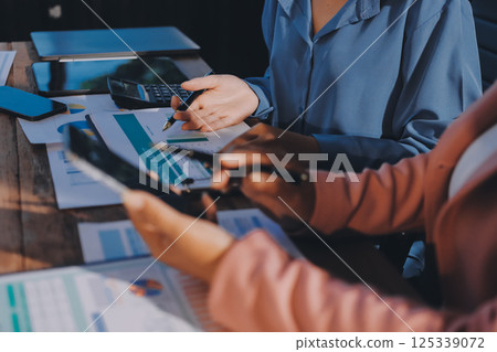 Business analyze,Close up Business people meeting to discuss the situation on the market. Business Financial Concept Business analyze,Close up Business people meeting to discuss the situation on the market. Business Financial Concept 125339072