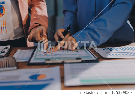 Business analyze,Close up Business people meeting to discuss the situation on the market. Business Financial Concept 125339089