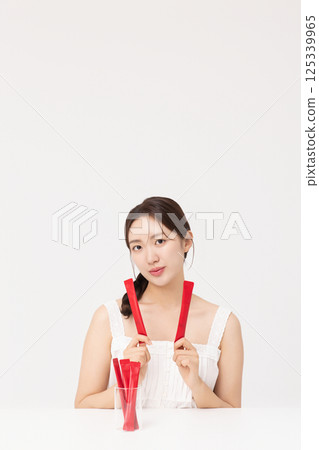 Portrait of young woman posing with health supplement products 125339965