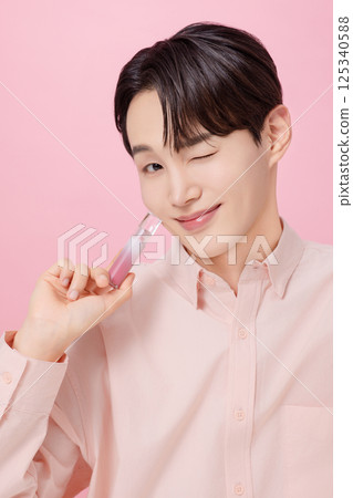 Portrait of a young man posing with a tint Portrait of a young man posing with a tint 125340588