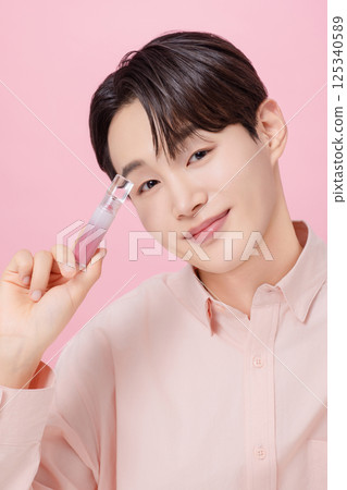 Portrait of a young man posing with a tint 125340589
