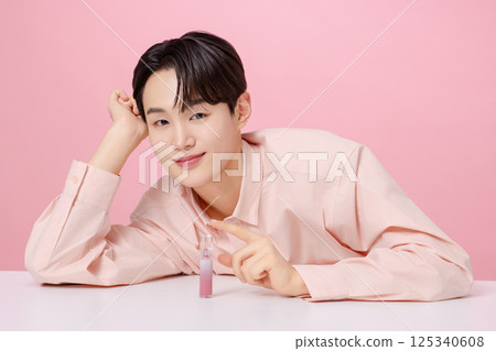 Portrait of a young man posing with his eyebrows Portrait of a young man posing with his eyebrows 125340608