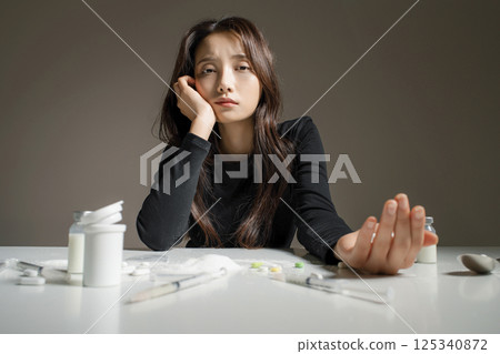 A young man in his 20s addicted to various drugs and drugs A young man in his 20s addicted to various drugs and drugs 125340872