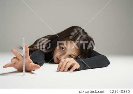 A young man in his 20s addicted to various drugs and drugs A young man in his 20s addicted to various drugs and drugs 125340880