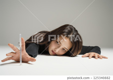 A young man in his 20s addicted to various drugs and drugs 125340882