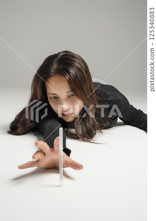 A young man in his 20s addicted to various drugs and drugs A young man in his 20s addicted to various drugs and drugs 125340883