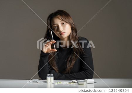 A young man in his 20s addicted to various drugs and drugs 125340894