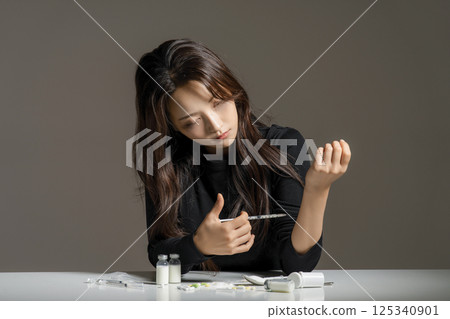 A young man in his 20s addicted to various drugs and drugs A young man in his 20s addicted to various drugs and drugs 125340901