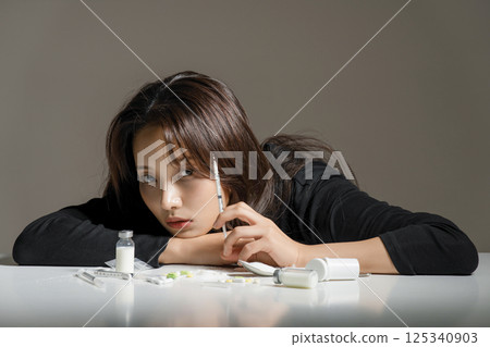 A young man in his 20s addicted to various drugs and drugs A young man in his 20s addicted to various drugs and drugs 125340903