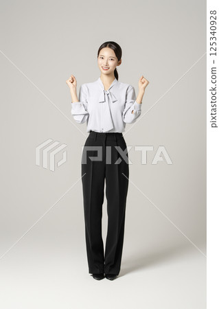 A neat-looking young woman in her 20s sitting on a chair next to a trash can containing drugs and syringes 125340928