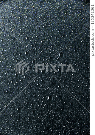 Water droplets on glass with black background 125341361