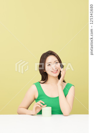 A pretty woman holding eco-friendly basic cosmetics 125341680