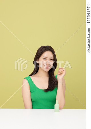 A pretty woman holding eco-friendly basic cosmetics 125341774