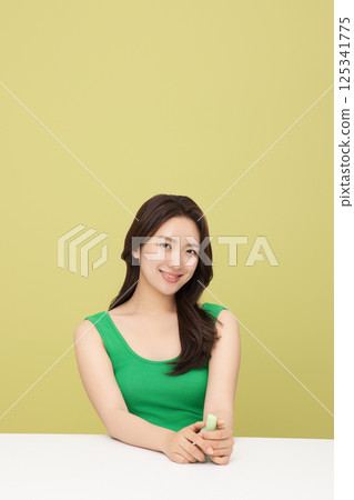 A pretty woman holding eco-friendly basic cosmetics 125341775