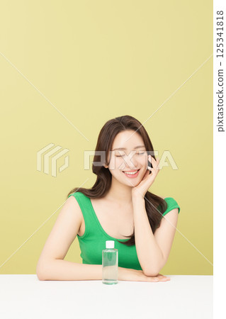 A pretty woman holding eco-friendly basic cosmetics 125341818