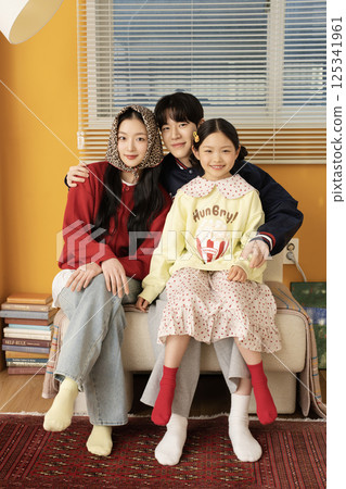 A family standing with a carrier 125341961