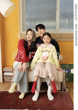 A family standing with a carrier 125341962