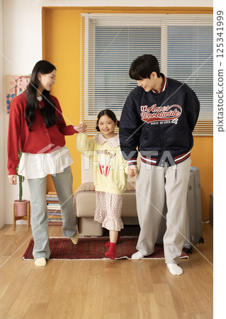 A young family playing games together 125341999