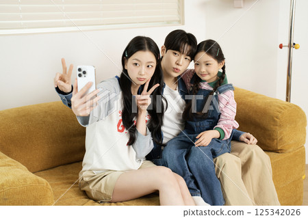 A family giving a high five together A family giving a high five together 125342026