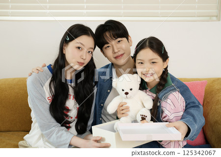 Parents nursing their sick child 125342067