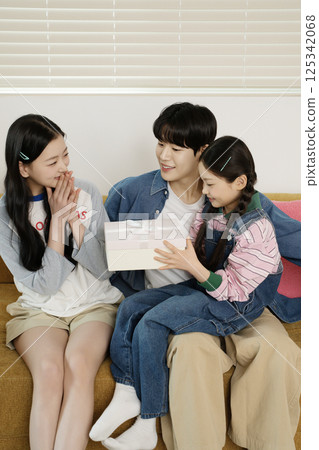 Parents nursing their sick child 125342068