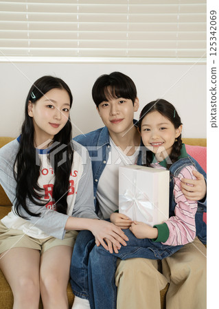 Parents nursing their sick child 125342069