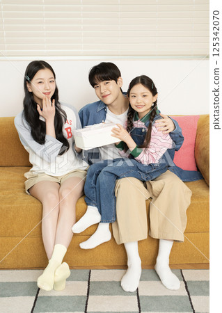 Parents nursing their sick child 125342070