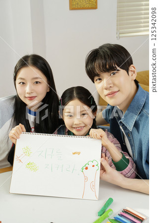 Portrait of a family lying in bed Portrait of a family lying in bed 125342098