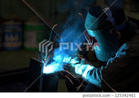Arc welding - A welder at work Arc welding - A welder at work 125342481