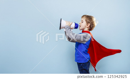Boy in superhero costume with megaphone Boy in superhero costume with megaphone 125342925