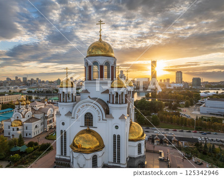 Autumn Yekaterinburg and Temple on Blood in beautiful clear sunset. Aerial view of Yekaterinburg, Russia. Translation of the text on the temple: Honest to the Lord is the death of His saints. 125342946